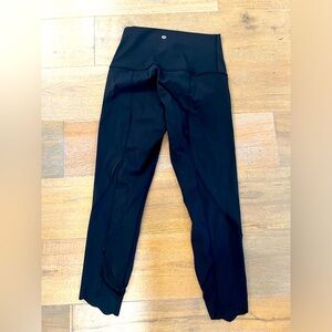 Lululemon size 8 black cropped leggings with scalloped/mesh ankle detail